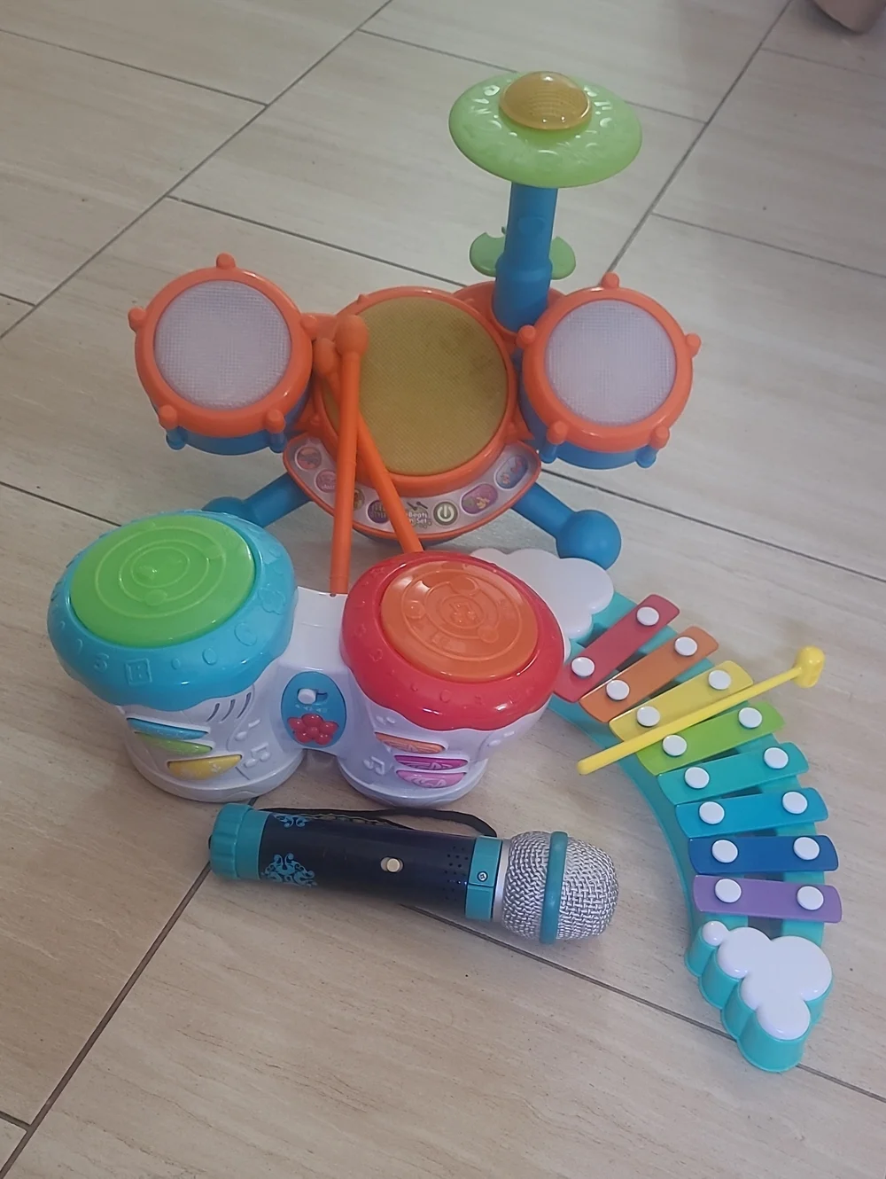 Kids Interactive Musical Instruments: Bongos, Microphone, Xlophone, & Drum Set.